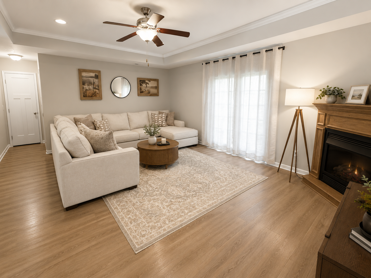 Spacious living room with sectional sofa, fireplace, and French doors